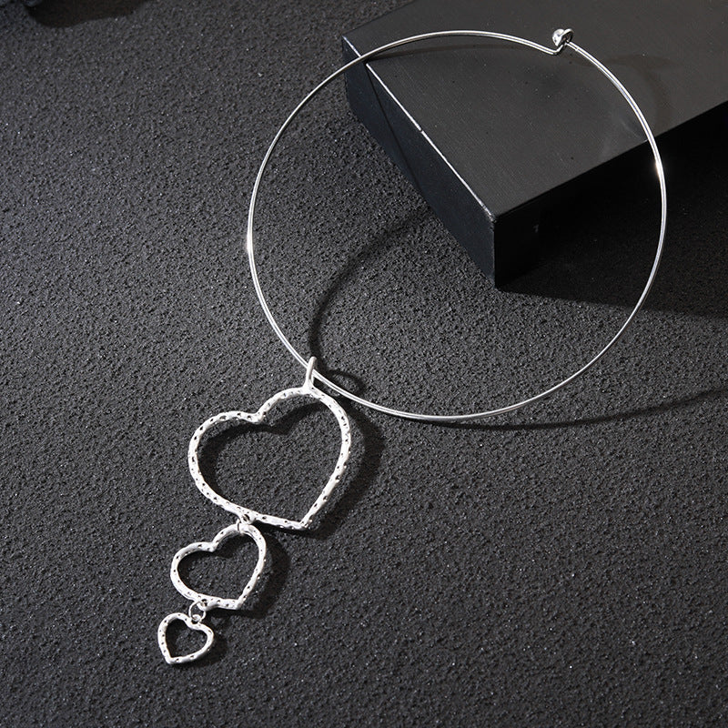 Silver Hoop Necklace with Cascading Heart Charms